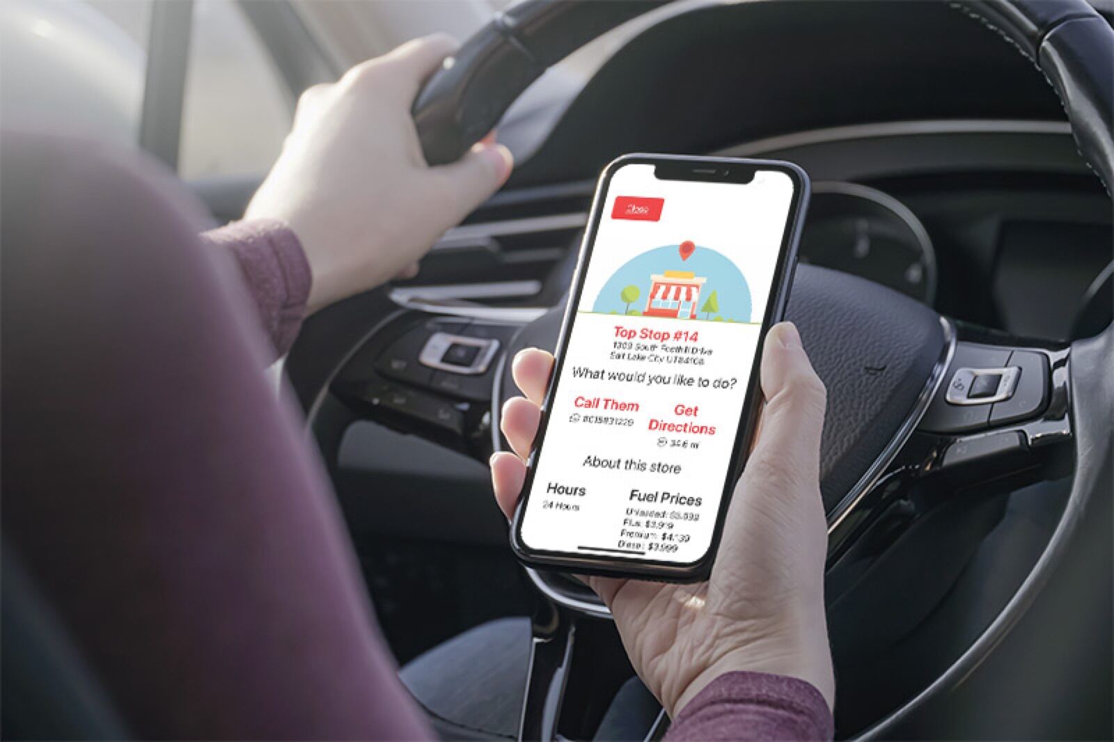A driver using the Top Stop Perx Plus app on a phone